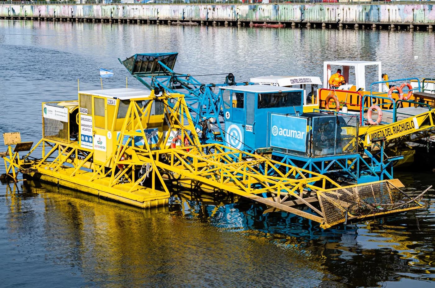 Environmental cleanup equipment working on a waterway
